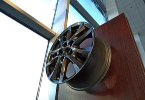 Graphite Painted Car Rim Displayed In Auto Parts Shop photo