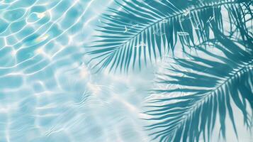 Top view of light blue water ripples with palm leaf shadow on concrete background, banner design, summer concept photo