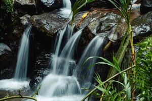 This unspoiled seasonal waterfall in the middle of the wilderness is called the Grenjengan Kembar waterfall. Detailed photos of the waterfall using a slow shutter speed technique