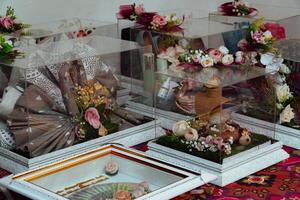 The offering box contains a wedding dowry with Indonesian culture. The dowry given by the groom to the bride when she is about to get married, contains beautifully and attractively decorated items photo