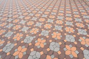 Paver brick floor also call brick paving, paving stone or block paving. Abstract background from paving red tiles, bricks. photo