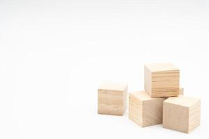 Wooden cube or wooden blocks isolated on a white background. Pile of wood block. Copy, empty space for text. photo