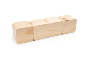 Four Wooden cubes in row. It is isolated on a white background with clipping path. Wooden toy blocks. empty copy space for message word. photo