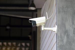 CCTV monitoring the building for the safety of the property and inspecting people entering and exiting the building. Soft and selective focus. photo