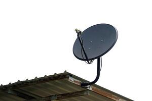 Satellite dish installed on the roof of the house for receiving television waves. Soft and selective focus. photo