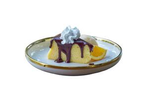 Cocoa Cotton Cake is a cake with a strong cream cheese flavor. The texture is soft and light, similar to chiffon. Gently top the cake with cocoa, serve with ice cream and decorate with orange petals. photo