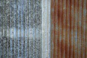 Old galvanized sheet background with rust pattern. Used for decorating the walls of restaurants, coffee shops, vintage style, cowboy style, backdrop. photo