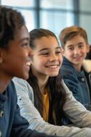a group of children smiling while sitting at a table photo