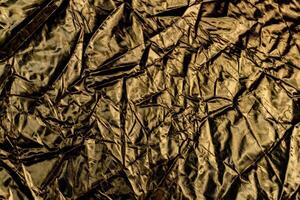 Gold crumpled paper for background wrinkled surface, design, wallpape photo