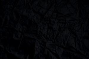 negro estropeado papel con sombra para antecedentes. arrugado superficie, diseño, papel tapiz foto