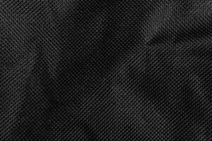 Black crumpled paper with shadow for background. wrinkled surface, design, wallpape photo