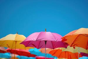 summer accessories sun umbrellas on sky background. photo