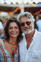 mature people enjoy summer party. photo