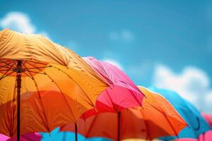 summer accessories sun umbrellas on sky background. photo