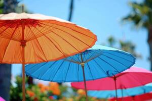 summer accessories sun umbrellas on sky background. photo