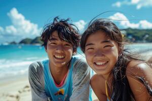portrait of happy Japanese teens relaxing on Okinawa beach. photo