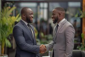 Two professional business men executive leaders shaking hands at office meeting, photo