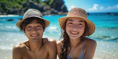 portrait of happy Japanese teens relaxing on Okinawa beach. photo