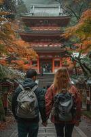 couple traveling in Japan, visiting temple. photo