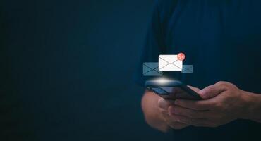 businessmen use their mobile phones to check newsletters or emails each day. For communication or receiving various news In the internet age, the concept of working anywhere photo