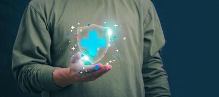 Businessman showing a symbol or icon related to health insurance or healthcare. Concepts for developing and accessing care anywhere, anytime, doing business related to the hospital business photo