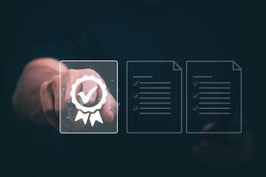Male hand pointing at symbol of guarantee of quality of service Certification concept and standard quality control Standard warranty Documents certified on virtual screen photo