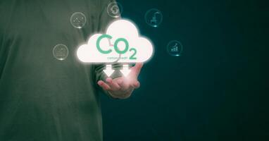 Ideas for reducing carbon emissions or using carbon credits for organizations. Businessman showing carbon credit and green business environmental conservation sustainable environmental development photo