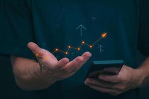 Planning and strategy, stock market, business growth, progress or success concept, businessman or trader showing growing virtual holographic stocks, invest in stock market trading or digital assets photo
