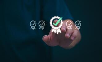 Male hand pointing at symbol of guarantee of quality of service Certification concept and standard quality control Standard warranty Documents certified on virtual screen photo