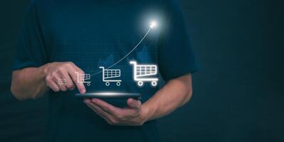 Businessman shows continued growth in online shopping with internet technology Concept of global data connectivity with internet technology, big data, data search, and online marketing. photo
