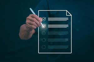 Businessmen mark check blocks to verify the correctness and approve or accept the agreement. in digital documents Concept of working via the internet photo