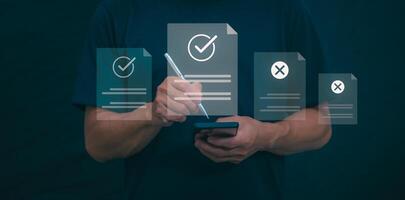 Male hand pointing at symbol of guarantee of quality of service Certification concept and standard quality control Standard warranty Documents certified on virtual screen photo