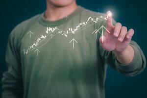 Planning and strategy, stock market, business growth, progress or success concept, businessman or trader showing growing virtual holographic stocks, invest in stock market trading or digital assets photo