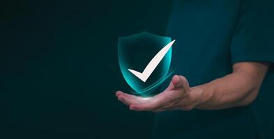 Male hand pointing at symbol of guarantee of quality of service Certification concept and standard quality control Standard warranty Documents certified on virtual screen photo