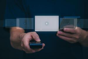 The man using smartphones, watching videos and studying online courses With the internet, the concept of global data connection with technology internet, big data, information search, online marketing photo