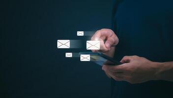 businessmen use their mobile phones to check newsletters or emails each day. For communication or receiving various news In the internet age, the concept of working anywhere photo