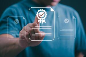 Male hand pointing at symbol of guarantee of quality of service Certification concept and standard quality control Standard warranty Documents certified on virtual screen photo