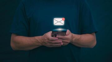 businessmen use their mobile phones to check newsletters or emails each day. For communication or receiving various news In the internet age, the concept of working anywhere photo