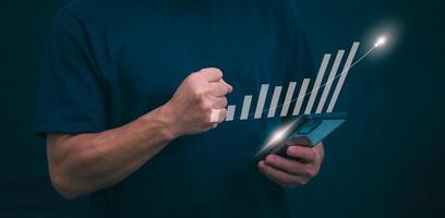 Planning and strategy, stock market, business growth, progress or success concept, businessman or trader showing growing virtual holographic stocks, invest in stock market trading or digital assets photo
