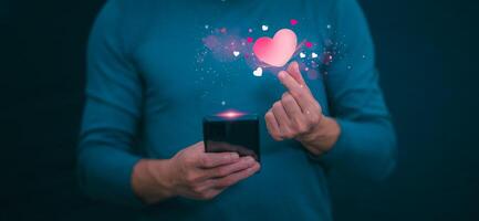 The concept of using digital media, technology, and social media. Surfing online, male hand using smartphone To play or use social media, remote work concept, work from home via the Internet photo