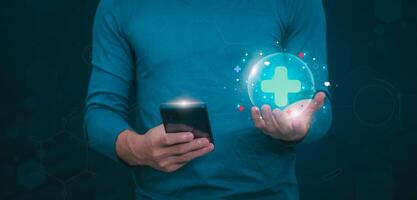 Businessman showing a symbol or icon related to health insurance or healthcare. Concepts for developing and accessing care anywhere, anytime, doing business related to the hospital business photo