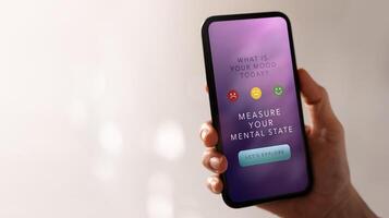Mental Health Concept. Using Mobile Application to Check, Measure and Practicing Mind. Self Care and Soothing Life. App show on Mobile Phone. photo