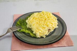Cheesy Salad on Grey Plate With Lettuce photo