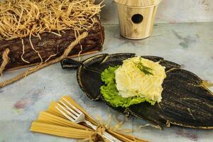 Leaf-Shaped Plate With Salad and Dill photo