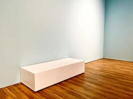 Empty room indoor mock up interior design with wooden flooring, light blue walls, and plain chair seat box isolated on horizontal ratio background. photo