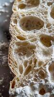 Artisan Sourdough, the airy and open crumb structure of a sliced artisan sourdough bread photo