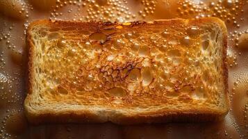 Toast Texture, detailed image of a perfectly toasted slice of bread, golden-brown crispy surface with tiny bubbles and char marks photo