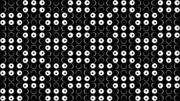 Bright background.Design.Small white light bulbs on a black background that blink and change colors in turn in abstraction. video