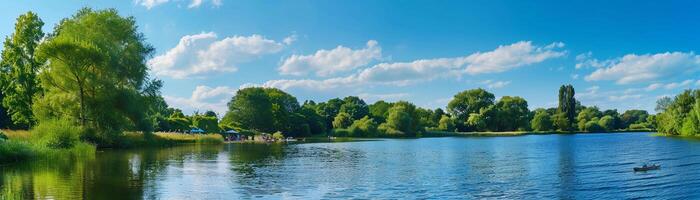 Riverside Picnic, a peaceful riverside scene with people having a summer picnic photo