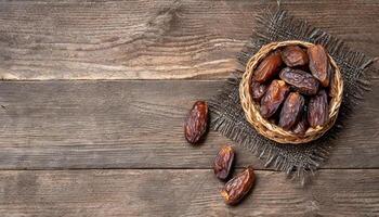 Ramadan promotion concept Dates are on a wooden table with copy space area photo
